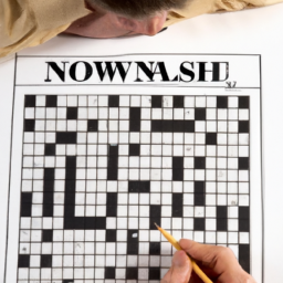 A person sitting at a desk with a pencil and a New York Times Crossword Puzzle in front of them.