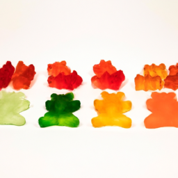 description: an image showing a variety of cbd gummies in different colors and shapes, neatly arranged on a white background.