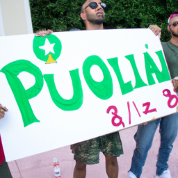 a group of people gathered in a protest, holding signs advocating for the legalization of marijuana in puerto rico.