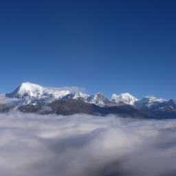 description: a mountain range with snow-capped peaks, surrounded by clouds.